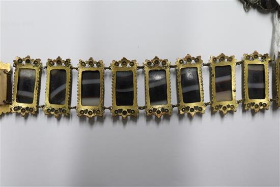 Two banded agate bracelets, one in gilt metal, one in white metal.